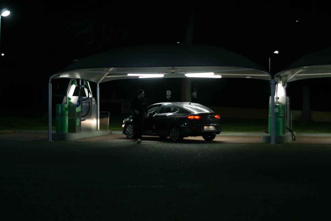  electric vehicle charging at home in garage at night