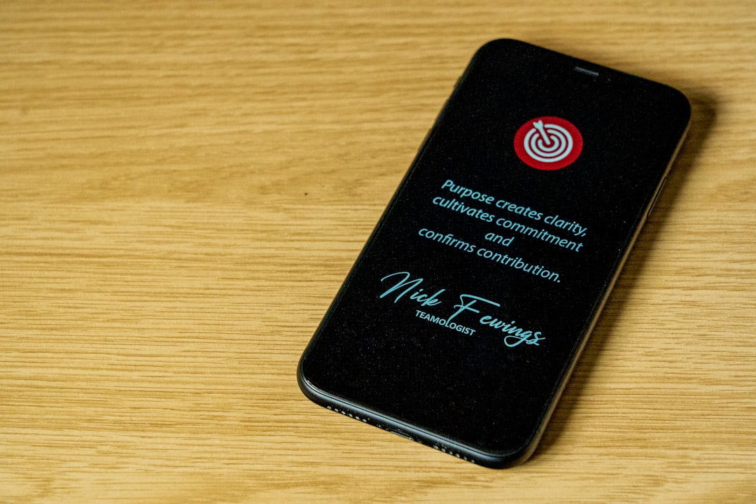 phone displaying scam warning with utility bill